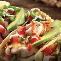 Fire-Grilled Street Tacos · Straight from the heart of Mexico–fire-grilled corn tortillas filled with melted cheese, roa...