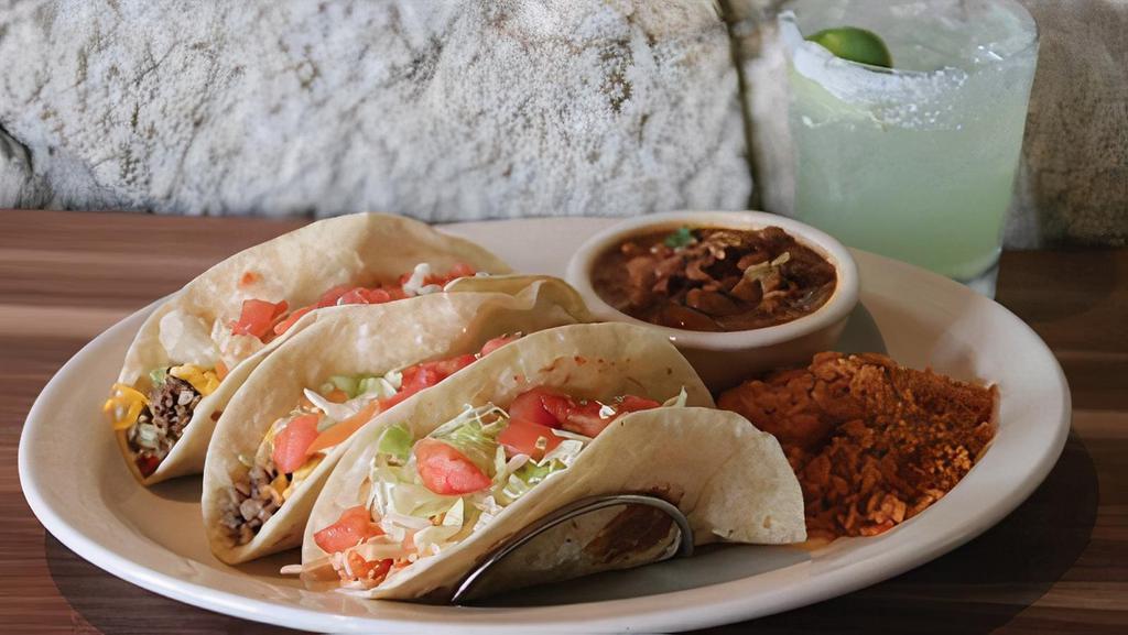 Soft Taco Plate · Choose between two or three pulled chicken, ground beef, mesquite grilled fajita chicken or beef tacos with lettuce, tomato, and shredded cheese.  Served with Mexican rice and frijoles a la charra.
