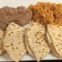 Kid Quesadilla · Cheddar cheese on our tortillas with grilled chicken or seasoned ground beef grilled. Served...