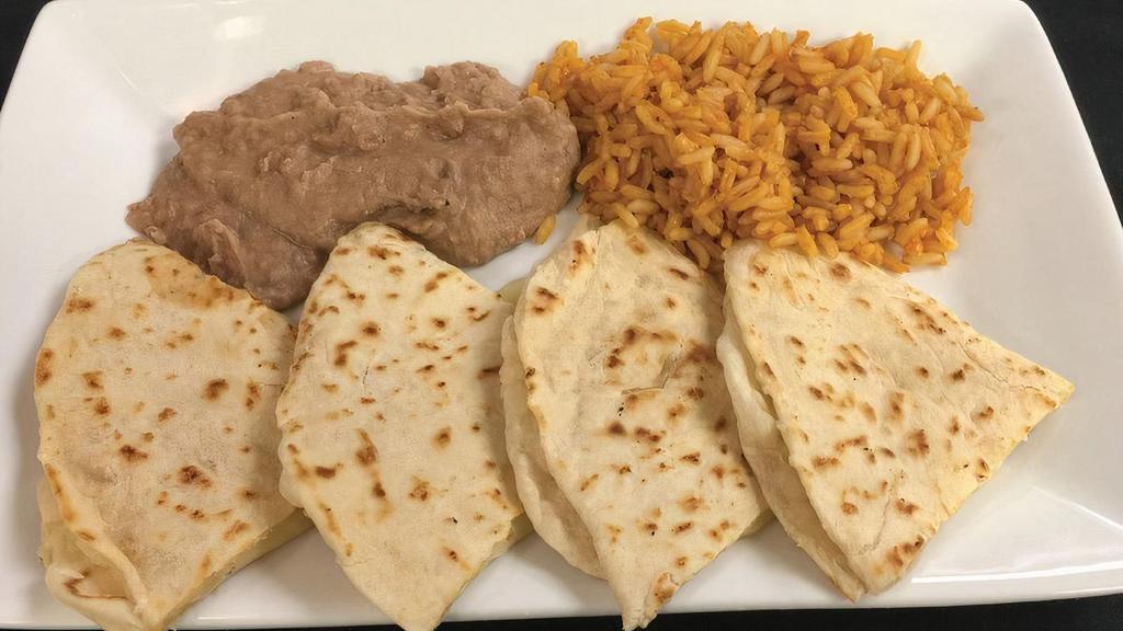 Kid Quesadilla · Cheddar cheese on our tortillas with grilled chicken or seasoned ground beef grilled. Served with rice and beans