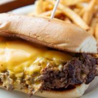 Black Angus Philly Cheese Steak · Black Angus flat iron steak shaved thin and grilled with braised onions and melted American ...