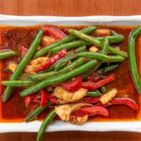 Pad Prik Khing · Red, and green bell peppers and green beans stir fried with lemon leaf, and spicy curry paste.