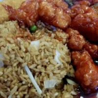 Orange Chicken · Tender pieces of chicken lightly dipped in lotus flour and quickly fried until outside is cr...