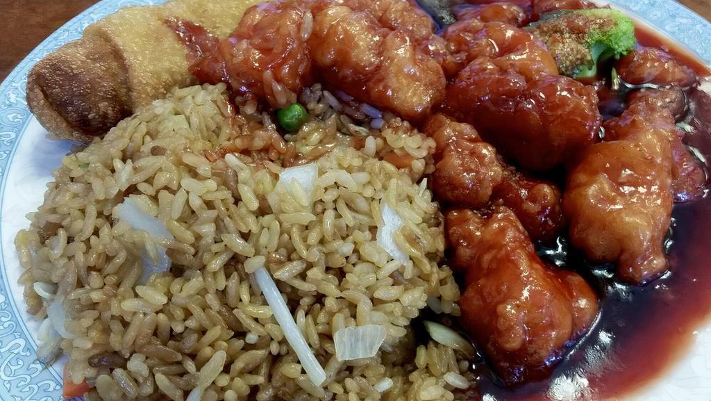 Orange Chicken · Tender pieces of chicken lightly dipped in lotus flour and quickly fried until outside is crispy and tender inside in a tangerine sauce. Served with choice of rice.