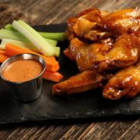 Hot Honey · 8 hot honey glazed wings, served with carrots & celery and a choice of classic ranch or Srir...