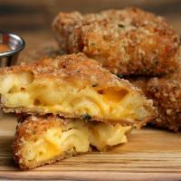 Classic Mac Bites · 4 Golden-fried mac & cheese bites served with house sauce for dunking