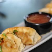 Pork Potstickers · pork filled and served with sweet chili dipping sauce