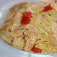 Shrimp Supreme · seven jumbo shrimp sautéed with onion and garlic, white wine cream sauce, linguine, diced to...