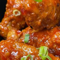11. Thai Wings (4) · Fried chicken mixed with sweet chili sauce.
