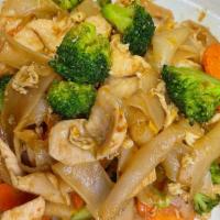 2. Pad See Ew · Wide rice noodles stir fried with egg, broccoli, and carrots in a seasoning brown sauce.