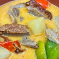 7. Roasted Duck Curry · Roasted duck, pineapple, bell pepper, tomatoes, basil leaves and green beans in Thai red cur...