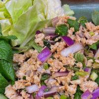 1. Larb (Pork Or Chicken) · Minced pork or chicken, green onions, carrot, cabbages, and roasted rice powder, tossed in s...