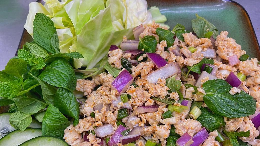 1. Larb (Pork Or Chicken) · Minced pork or chicken, green onions, carrot, cabbages, and roasted rice powder, tossed in spicy lime sauce.