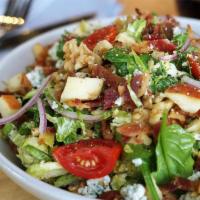 Shaved Brussel Sprout Salad · Spinach, romaine, bleu cheese, walnuts, apple, bacon, cherry tomatoes, red onion and red win...