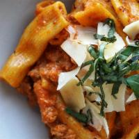 Rigatoni Bolognese · house made slow cooked ragu meat sauce, shaved parmesan, basil