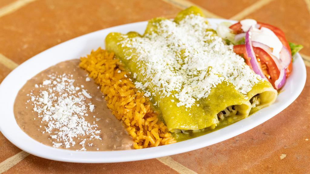 Enchiladas Combo · Three chicken or cheese enchiladas topped with cheese served with rice and beans.
AVAILABLE 
IN GREEN OR RED SAUCE AND MOLE !