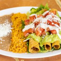 Taquitos Combo / Rolled Taquitos · 3 Rolled chicken taquitos topped with lettuce, tomatoes, cheese, sour cream and guacamole, w...