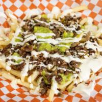 Carne Asada Fries · French fries topped with refried beans meat cheese guacamole sour cream.