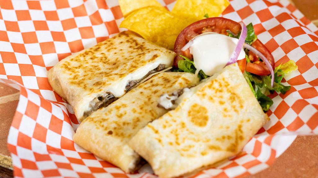 Quesadilla With Meat · Flour quesadilla with choice of meat.