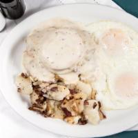 Chicken Fried Steak & Eggs · 4oz beef fritter with a biscuit on top smothered with white sausage gravy. Two eggs any styl...