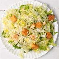 Classic Caesar Salad · Romaine, parmesan cheese & garlic-herb croutons tossed in
Caesar dressing.