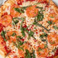 Margherita Pizza · Roma tomatoes, fresh basil and Parmesan with butter-garlic sauce.