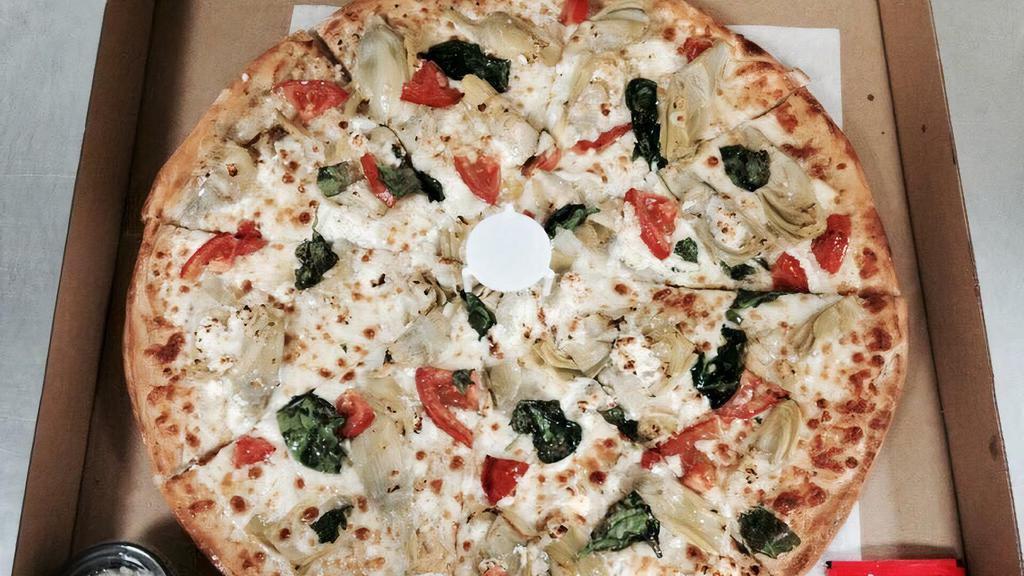 Spinach Garlic Chicken Pizza · Grilled chicken, mushrooms, spinach, Roma tomatoes, roasted garlic and mozzarella with butter-garlic sauce.