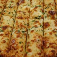 Cheesy B · Our soon to be legendary cheese bread - House Crust + Garlic Parmesan Sauce + Mozzarella + P...