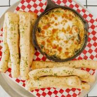 Spinny Dip · A big portion of House Made Spinach Artichoke Dip and our Hand Cut High Rise Bread Sticks + ...