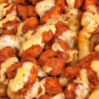 Medium Buffalo Fries · Buffalo Fries tossed in Medium sauce  on top of fries , covered with our special sauce.