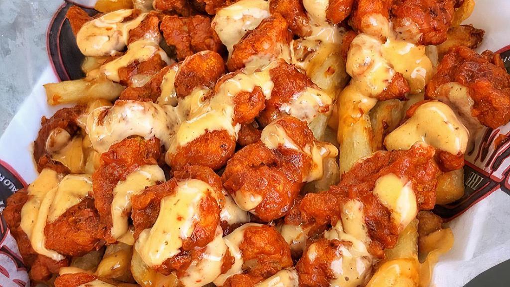 Honey Sriracha Buffalo Fries · Buffalo Fries tossed in Honey Sriracha sauce on top of fries and covered with our special sauce.