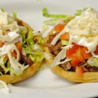 Sopes · Your choice of meat. Comes with beans, meat, sour cream, lettuce, & cheese.