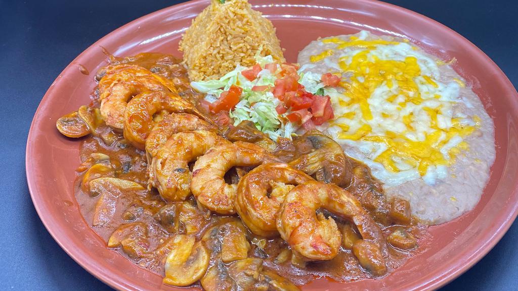 Camarones À La Diabla · Large shrimp slightly breaded and fried, garnished with a salad and our special tartar sauce