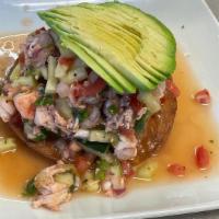 Tostada Ceviche · shrimp or fish cooked in lime juice, house seasoning, pico de gallo with cucumber and topped...
