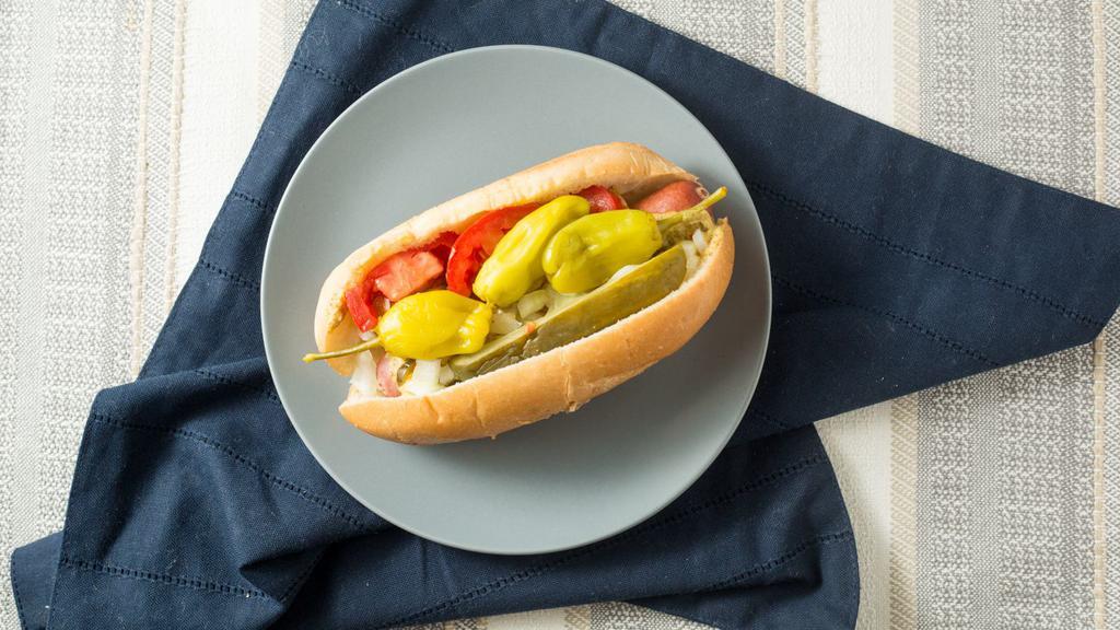 Chicago- Style Frank With The Works · Kosher frank on a bun with mustard, relish, pickle, raw onions, tomatoes and choice of peppers.