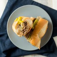 Chicago Style Italian Beef - Half · Our roasted top round, sliced thin and marinated in its own gravy, stuffed in Italian bread ...