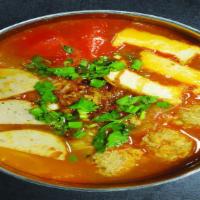 Bún Riêu · Rice noodle tomato soup with seafood balls, pork, and tofu.