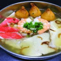 Bánh Canh Sài Gòn · Udon noodle soup with pork, Shrimp, Fish ball, and imitation crab meat.