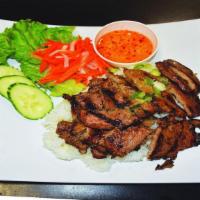 Cơm Thịt Nướng · Grilled pork with steamed rice.