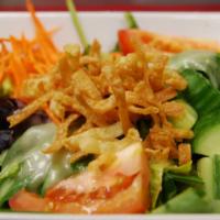 House Salad · Vegetarian. Spring mix with carrots, tomatoes, cucumber, with house specialty salad.