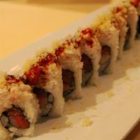 Fire Cracker · Tuna and yellowtail roll topped with crab, eel sauce, chili sauce and tempura crunches.