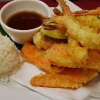 Tempura Dinner · Lightly battered Shrimp and vegetables served with house dipping sauce and steamed rice.