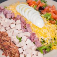 Chef Salad · Mixed Greens, turkey, ham, bacon bits, cheese, hard-boiled egg, and tomato.