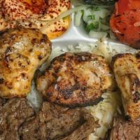 Meat Combo Plate · Choice of two proteins over basmati rice and greek salad & signature sauce.