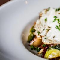 Brussels Sprouts · Bacon, shallots, roasted garlic, chili flake, sunny-side-up egg, chives.