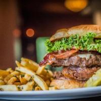 Twigs Signature Burger · Locally sourced Angus beef, honey-cured bacon, tempura onion ring, white cheddar, lettuce, t...