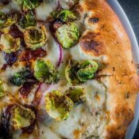 Bacon Brussels · Parmesan cream, bacon cream cheese, mozzarella, candied bacon, red onion, cracked black pepp...