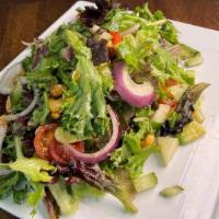 Vegan Chopped Salad · Spring greens, cherry tomato, avocado, red onion, cucumber, spiced roasted cashews, golden b...