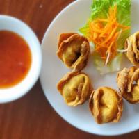 Crab Rangoon · Crab meat and soft cream cheese wrapped in crispy wonton shell.