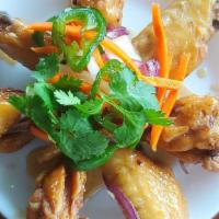 Cramelized Fish Sauce Chicken Wings · Fried chicken wings cramelized with garlic, butter, red pepper and fish sauce.